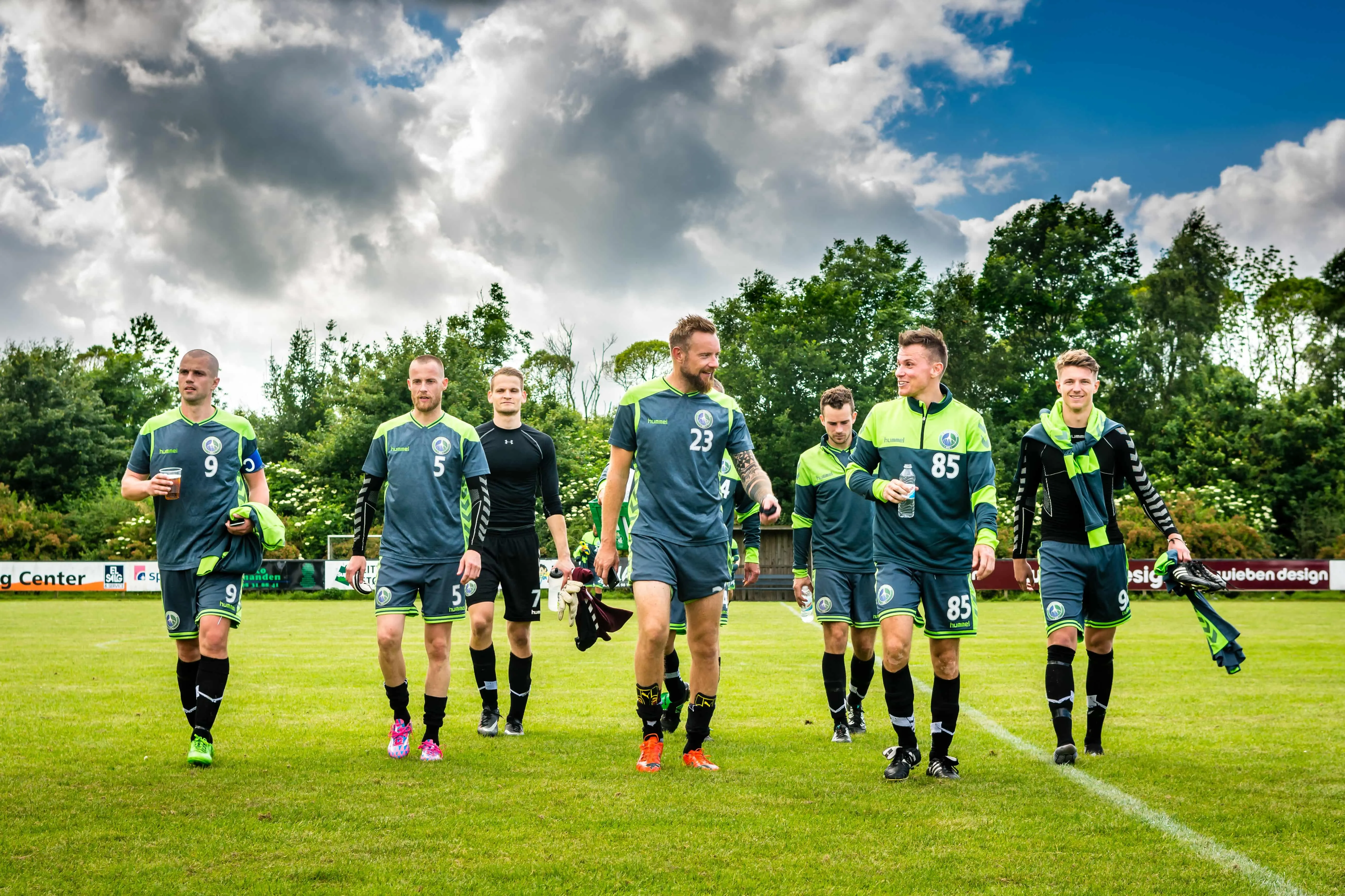 team background soccer players in custom jerseys facing away